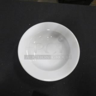 New 9-inch white bowl, model 7XBID, in pristine condition. Smooth finish, ideal for serving or display.