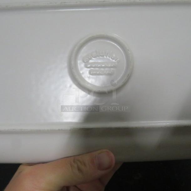 14x6.5 rectangular Evolution plate, model 10XBID, white ceramic with embossed Evolution logo, excellent condition.