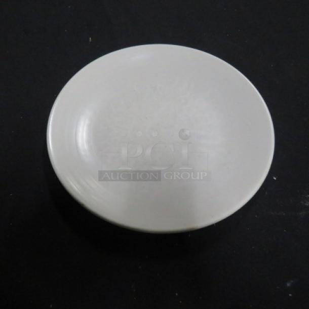 9-inch white Evolution plate, model 10XBID, in good condition, smooth finish, no visible markings or tags.