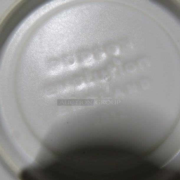 White Evolution 6.5-inch saucer, new condition. Base marked "Evolution, England, 2012." Perfect for collectors.