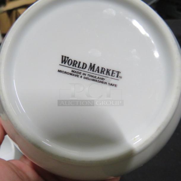 5-inch World Market bowl, white, marked "Made in Thailand," microwave and dishwasher safe. Item code: 14XBID.