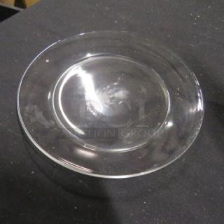 8-inch clear glass plate in excellent condition on a black surface. Simple and elegant design. Item code: 12XBID.