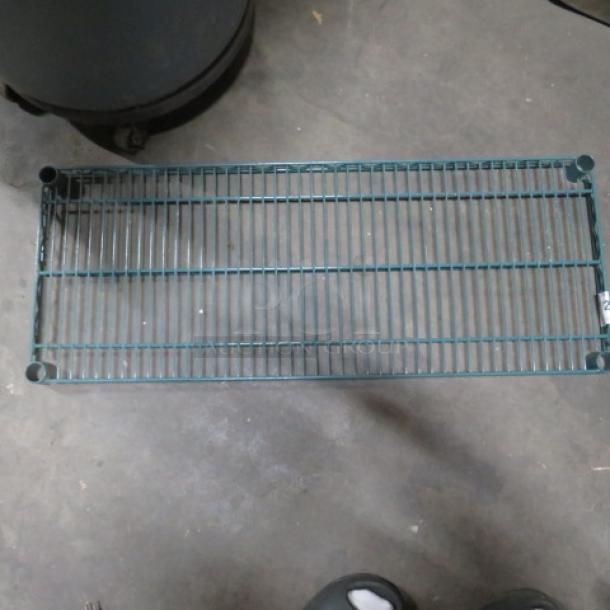 Green Metro shelf, 36x14 inches, wire design, used condition. Durable construction, visible authentic Metro label.