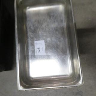 Full-size 4-inch deep stainless steel hotel pan. Light wear visible. Label with code "325" on surface.