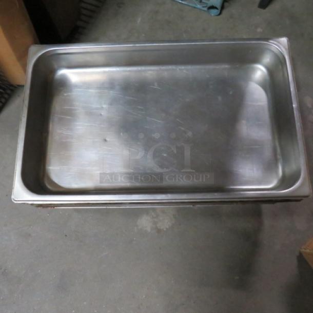 Full-size 2.5-inch deep stainless steel hotel pan, lightly scratched, suitable for commercial kitchen use. Model 2XBID.