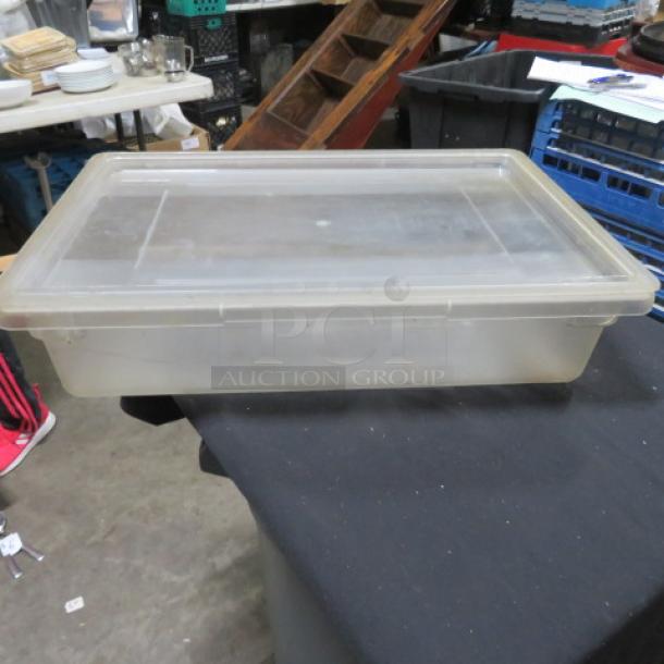 Clear 8.5-gallon food storage container with lid, translucent plastic, rectangular shape, used condition.