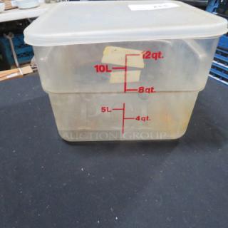 Clear 12-quart food storage container with lid, marked with red measurement lines in liters and quarts. Used condition.