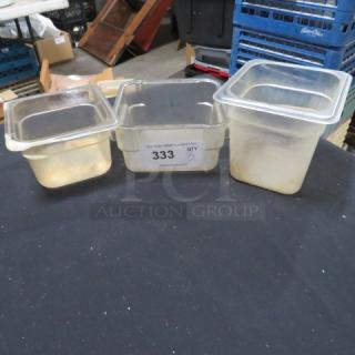 Assorted food storage containers, translucent plastic, square shape, used condition. Auction tag "333" visible.