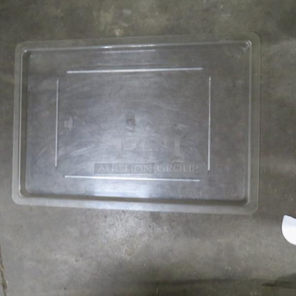 Clear rectangular food storage lid, labeled "3XBID," in good condition. Measures approximately 22x15 inches. Durable plastic material.