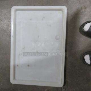 White rectangular food storage lid, model 2XBID. Used condition with visible stains and scuffs.
