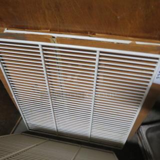 White metal rack, 22x24 inches, in good condition, with fine grid design, suitable for storage or shelving.