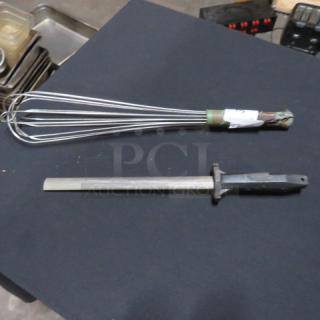 Assorted utensils: a stainless steel whisk and honing rod. Whisk shows minor wear; includes label indicating "2XBID."