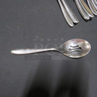 Lot of 14 silver-toned slotted spoons, stainless steel, lightly used, ideal for serving, clean design.