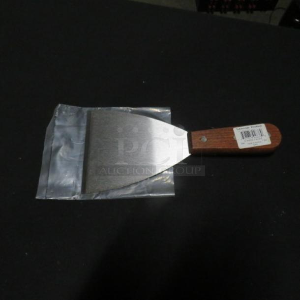 NEW 4 Inch Scrapper Blade with wooden handle, attached label reads "2XBID." Unused, in original packaging.