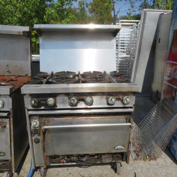 Jade Bistro 6 Burner Natural Gas Range with stainless steel over shelf, on casters, dimensions 36x32x58 inches.