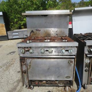 Jade Bistro 6 burner natural gas range with stainless steel over-shelf on casters, 36x32x58, visible rust, used condition.
