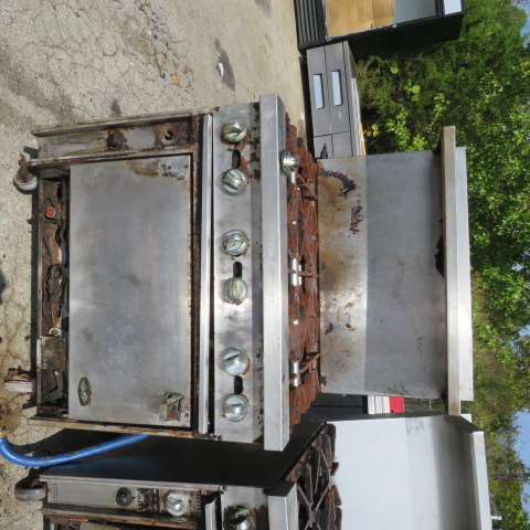 Heavily soiled commercial range showing maintenance neglect