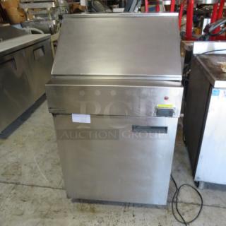 Delfield 1 Door Refrigerated Prep Table, Model 18MC27P-BI, stainless steel, 27x32x49 inches, on casters, includes 2 racks.