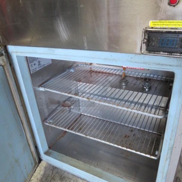 Delfield 1 Door Refrigerated Prep Table Model 18MC27P-BI with 2 racks, on casters, 115 Volt, shown open.