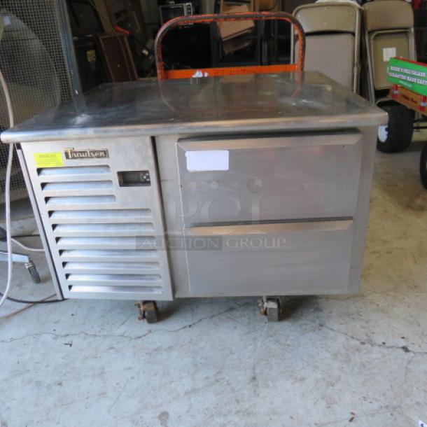 Traulsen TEO36HT chef base, 2 drawers, stainless steel, on casters, 36x34x26.5 inches, 115 volts, used, model and brand labels visible.