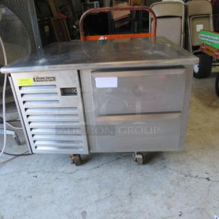 Traulsen TEO36HT chef base, 2 drawers, stainless steel, on casters, 36x34x26.5 inches, 115 volts, used, model and brand labels visible.