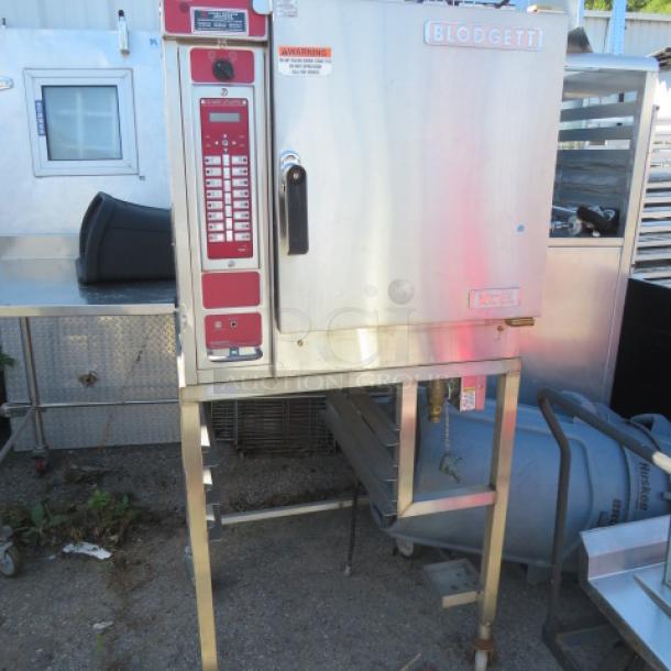 Blodgett XCEL convection oven, model XL50EC, on stand with casters. Measures 32x35x69 inches, 208V, 3 phase. Unable to test.