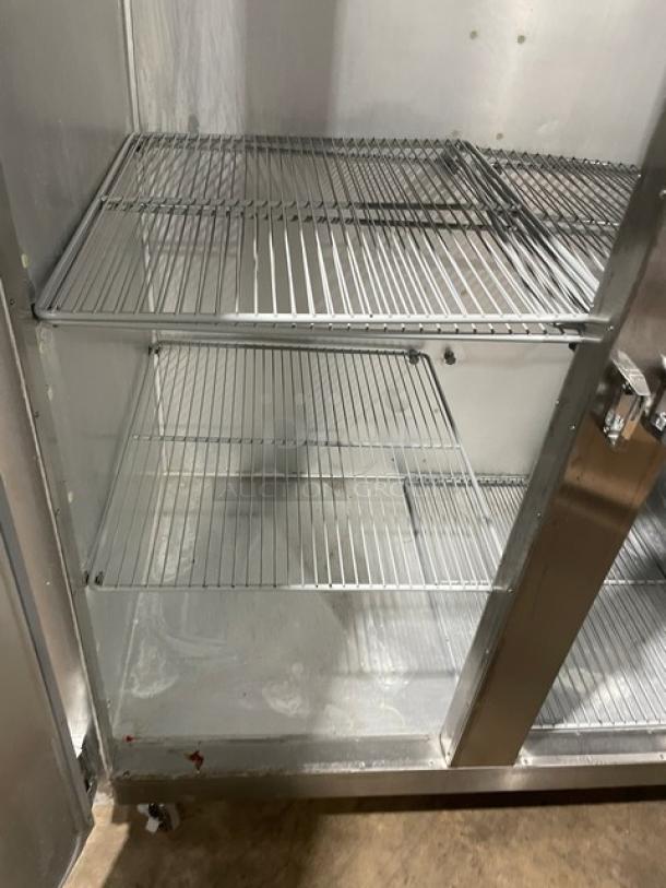 Traulsen G-Series stainless steel 2-door refrigerator, model G20010, on casters with poly-coated racks, Energy Star certified.
