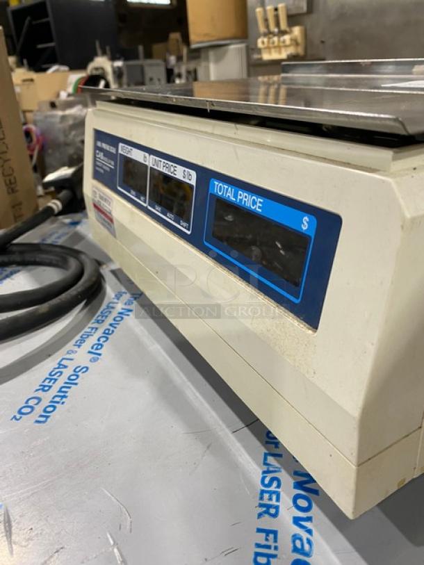CAS-USA LP-1000 digital price computing scale, 30 lb capacity, stainless steel worktop, label printer, countertop model.