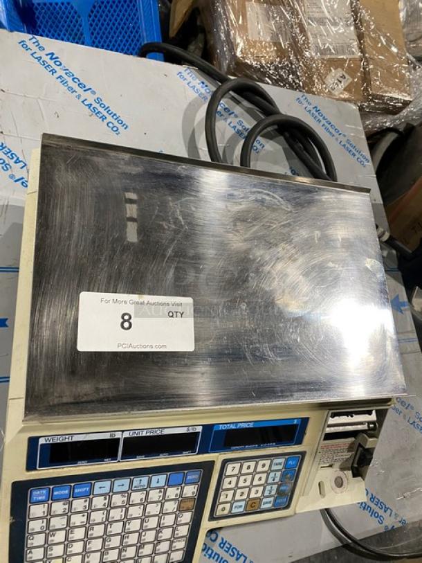 CAS-USA LP-1000 digital price computing scale with label printer, stainless steel worktop, 120V, 30 lb capacity, on legs.