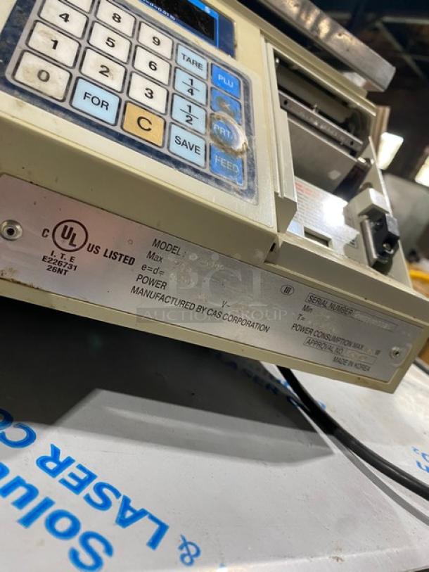 CAS-USA LP1000 digital price computing scale with label printer, stainless steel worktop, 120V, on legs. Model: LP-1000.
