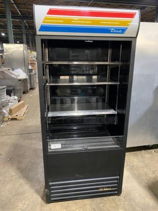 True TAC36 refrigerated display case, black, multi-tier, open-air with pull-down night curtain. Model TAC-36, SN: 7546117.