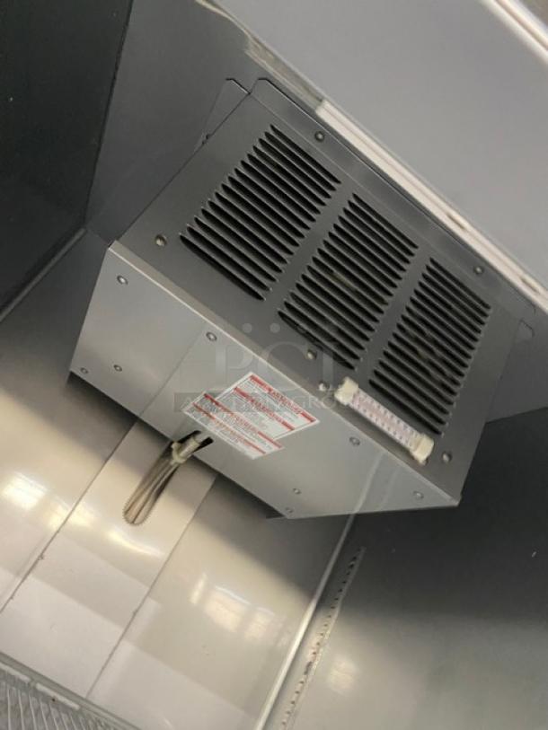Commercial fridge interior with wiring unit, part of Beverage-Air Vista Series, Model RB23HC-1S-18, SN 13800966, on casters.