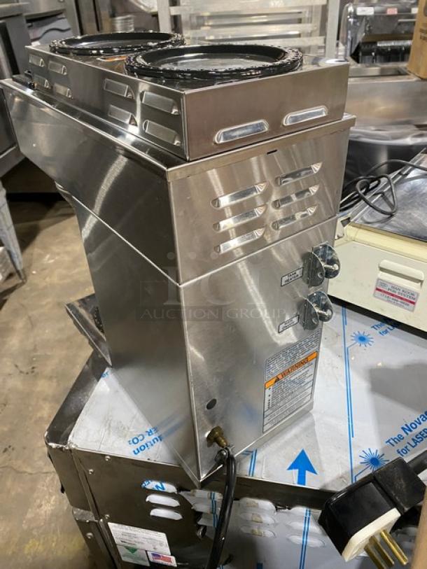 Bunn CW Series CWT35 stainless steel coffee brewing machine with dual upper-level warmer plates and brew basket, 120V.
