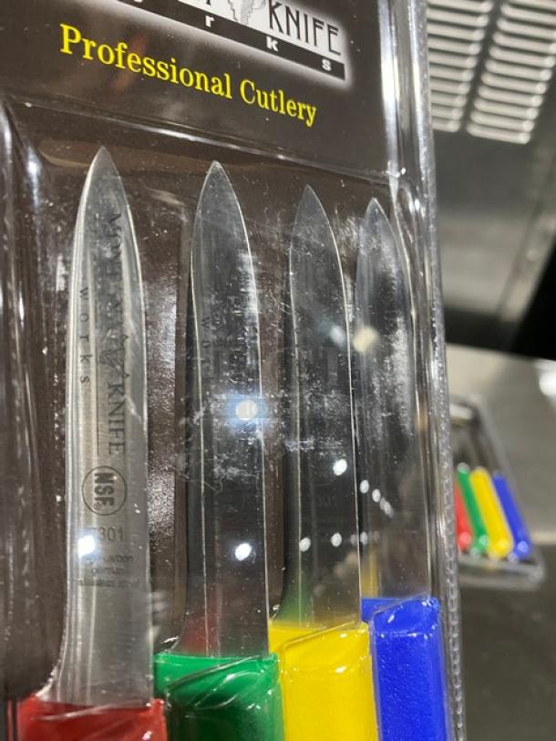 Set of four Montana Knife 3-1/4" paring knives, model 7401, with stainless steel blades and multi-colored grip handles. Mint condition.