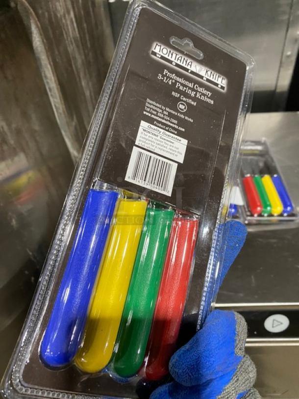 Montana Knife Model 7401 set with four 3-1/4" stainless steel paring knives. Multi-colored grips, new condition.