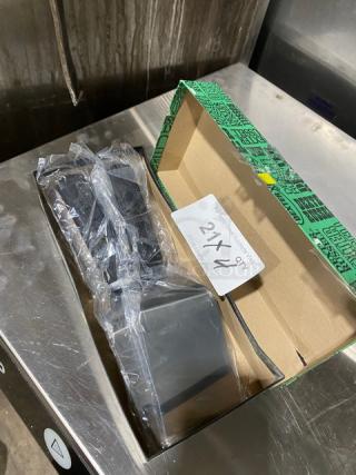 Dexter Russell Sani-Safe stainless steel hamburger turner, model S286-4, with black grip handle, new in packaging.