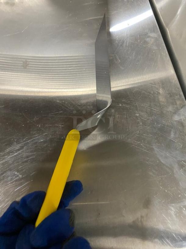 Dexter Russell 8"x3" stainless steel turner, model 31989Y, new condition, yellow grip handle.