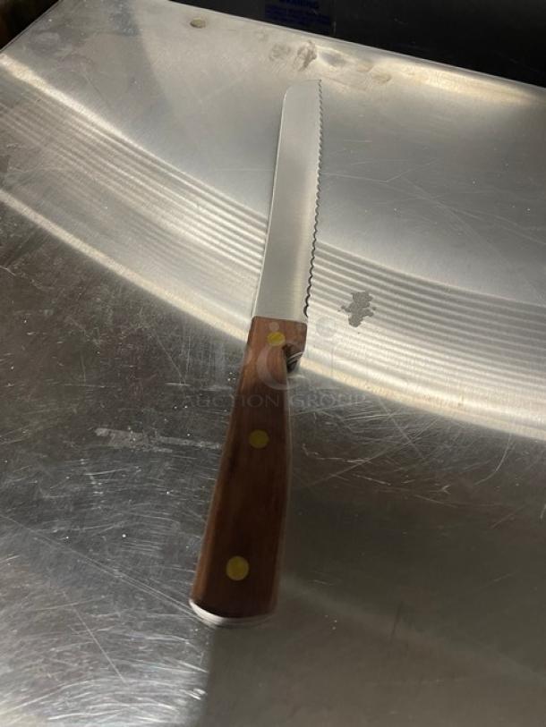 Dexter Russell 8" bread knife, stainless steel blade, model 628, wooden grip handle, new condition.