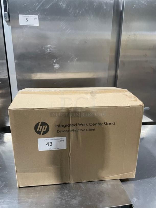 Brand new HP Integrated Work Center in original box, compatible with Desktop Mini/Thin Client, box label indicates quantity.