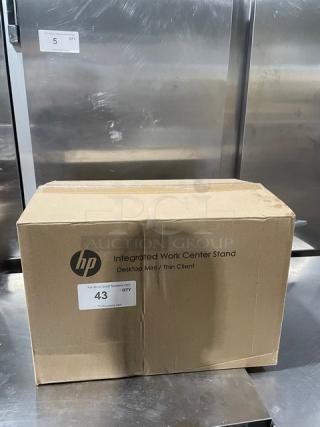 Brand new HP Integrated Work Center in original box, compatible with Desktop Mini/Thin Client, box label indicates quantity.