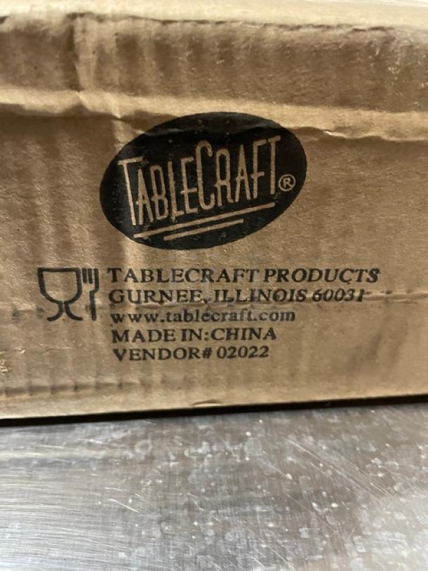 Box of Tablecraft Model 260SL cheese/spice shakers, 36 per case, featuring swirled clear glass and chrome-plated tops.