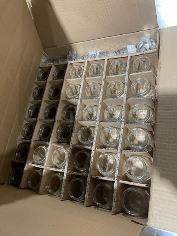 Brand new Tablecraft 6 oz. clear glass cheese/spice shaker, Model 260SL. Swirled style, chrome plated slotted top, 36 per case.