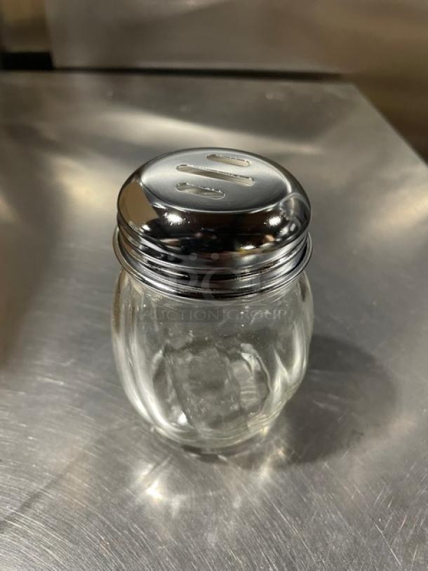 Tablecraft 260SL clear glass 6 oz cheese/spice shaker, swirled design, chrome-plated slotted top, brand new condition.