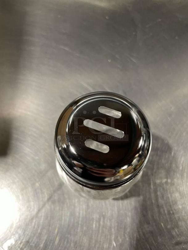 Brand new Tablecraft 6 oz glass shaker, swirled design, chrome-plated slotted top, model 260SL. 36 per case.