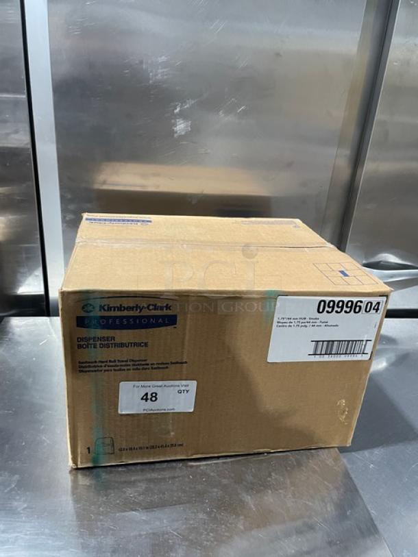 Brand new Kimberly Clark Sanitouch paper towel dispenser, model 09996, in original sealed box.