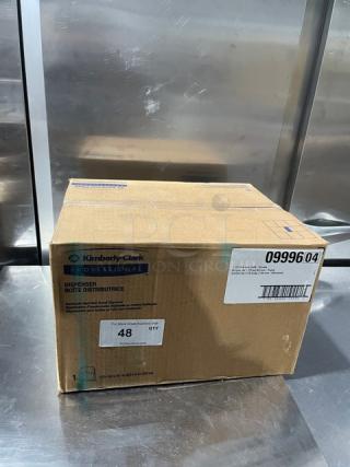 Brand new Kimberly Clark Sanitouch paper towel dispenser, model 09996, in original sealed box.