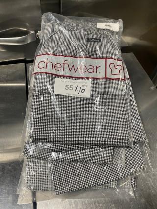 Brand new Chefwear CW11 black & white bar/chef pants in medium. Packaged in clear bag with branding and size label visible.