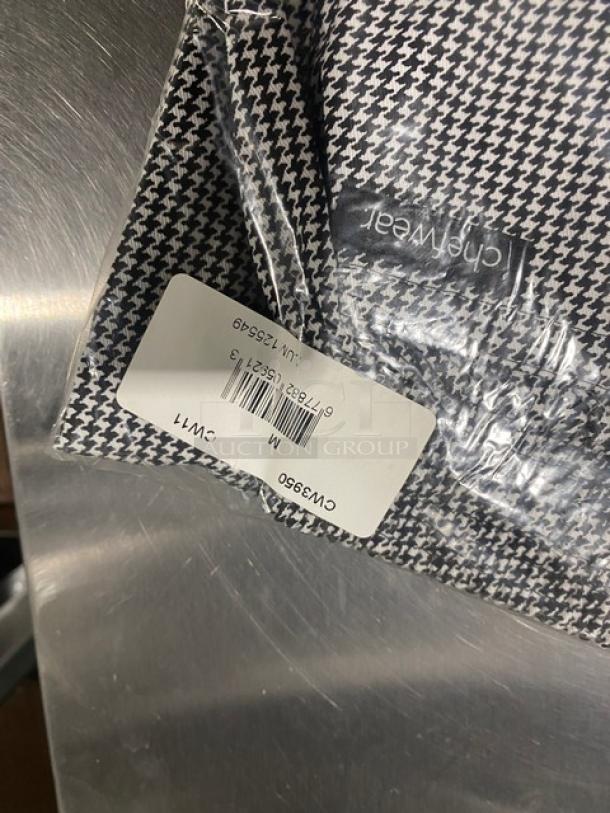 Brand new Chefwear CW11 commercial black & white houndstooth chef pants, medium size, in original packaging with tag.
