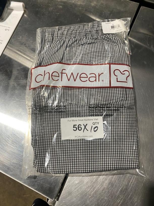 Brand new Chefwear CW3900 black and white small-size bar/chef pants in package. Model and brand labels visible.