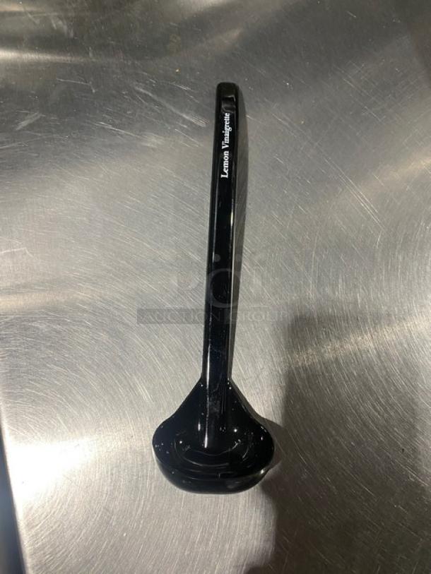 Carlisle 9.5" black lemon vinaigrette ladle, model 02955979, brand new, with "Lemon Vinaigrette" labeling on handle.